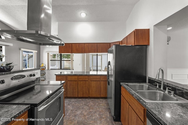 4405 Plumosa St, Spring Hill, FL 34607 - kitchen featuring island exhaust hood, a sink, dark countertops, brown cabinetry, and appliances with stainless steel finishes