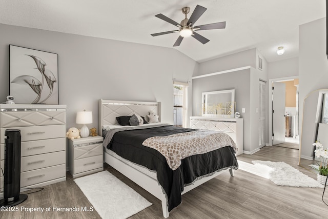 4405 Plumosa St, Spring Hill, FL 34607 - bedroom featuring lofted ceiling, wood finished floors, visible vents, connected bathroom, and baseboards