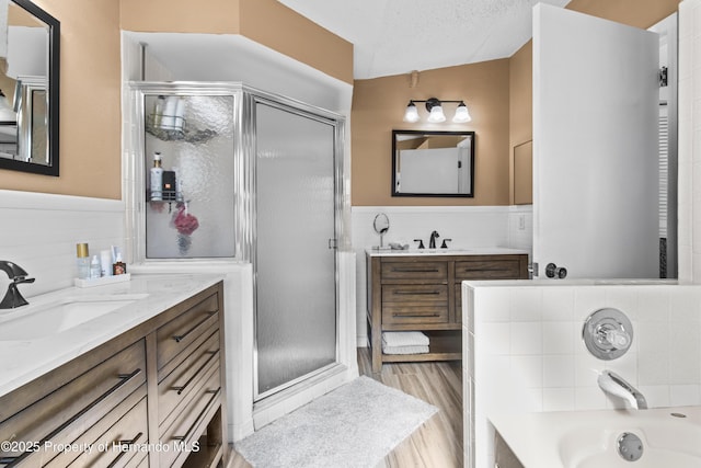 4405 Plumosa St, Spring Hill, FL 34607 - bathroom with a wainscoted wall, a sink, and a stall shower