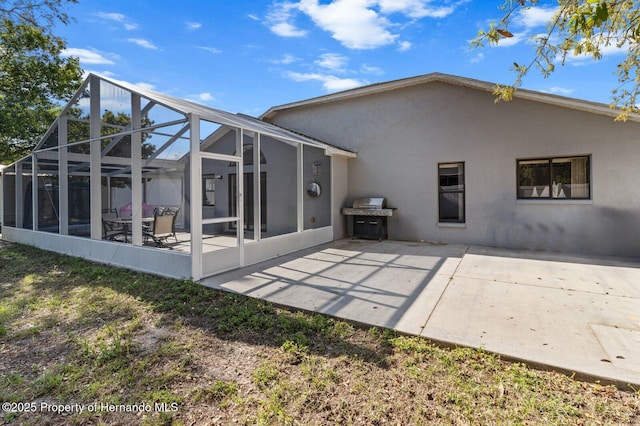 4405 Plumosa St, Spring Hill, FL 34607 - rear view of house featuring a patio area, a lanai, and stucco siding