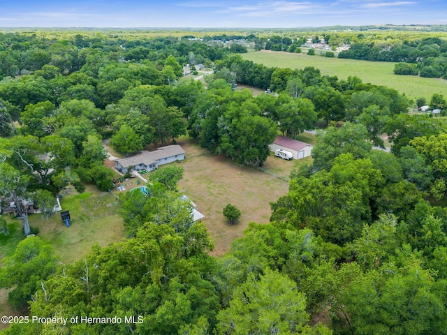 birds eye view of property with a rural view