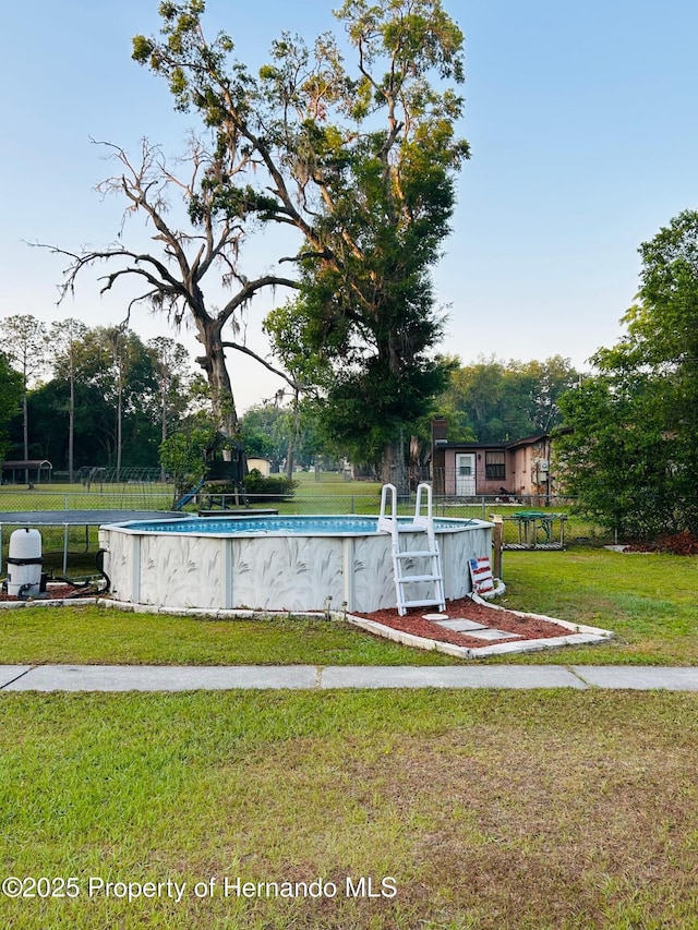 pool featuring a lawn