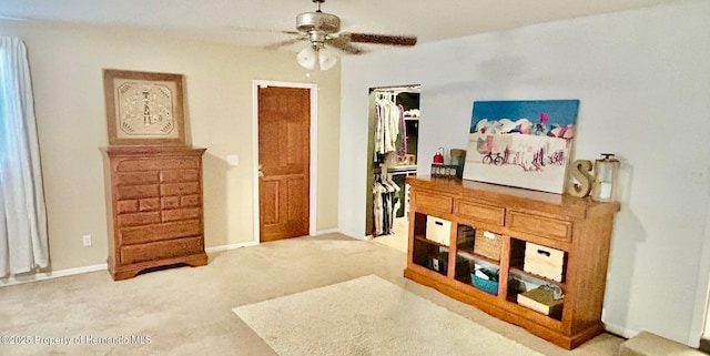 bedroom featuring baseboards, a ceiling fan, and carpet flooring