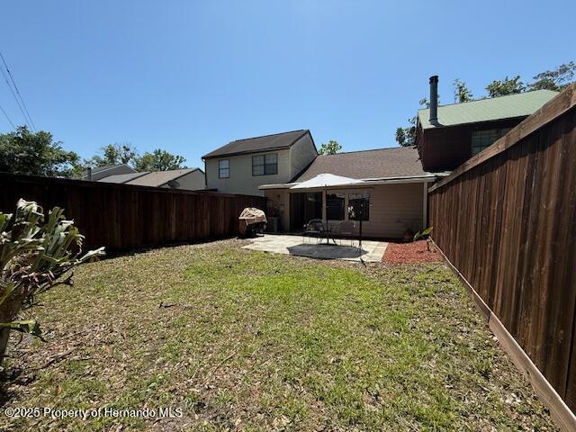 947 Village Dr, Brooksville, FL 34601 - view of yard with a patio