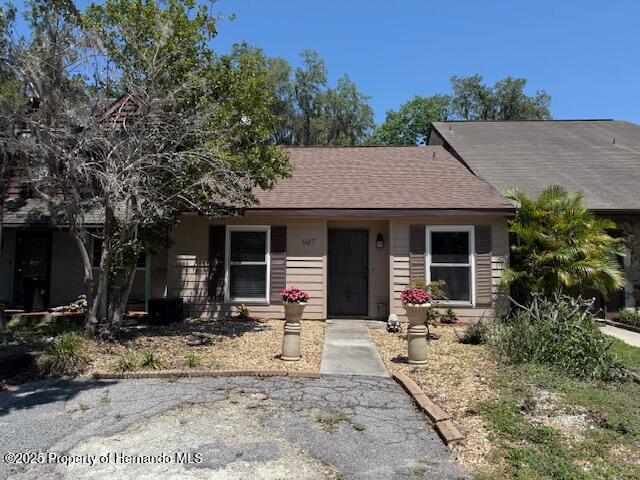 947 Village Dr, Brooksville, FL 34601 - single story home with a shingled roof