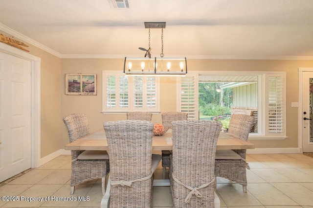 dining area featuring ornamental molding, baseboards, light tile patterned flooring, and visible vents