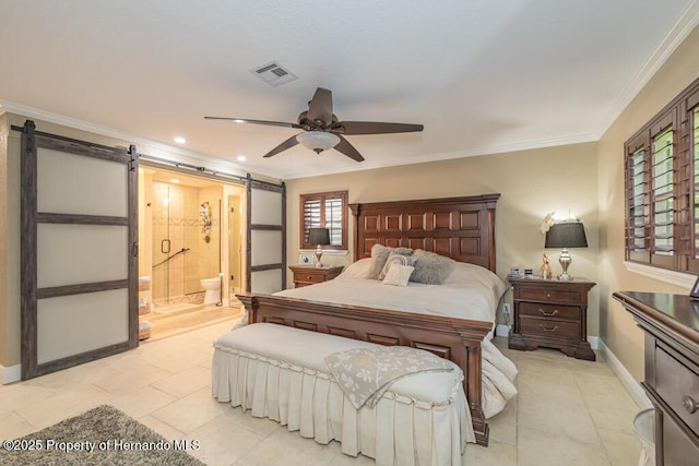 bedroom with a barn door, crown molding, light tile patterned flooring, baseboards, and ensuite bath