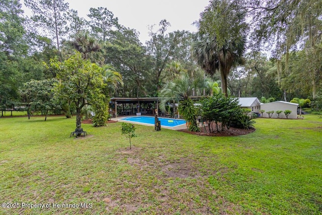 view of yard with an outdoor pool