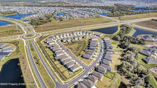 bird's eye view featuring a water view and a residential view