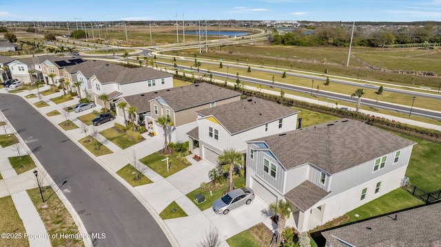 aerial view featuring a residential view and a water view