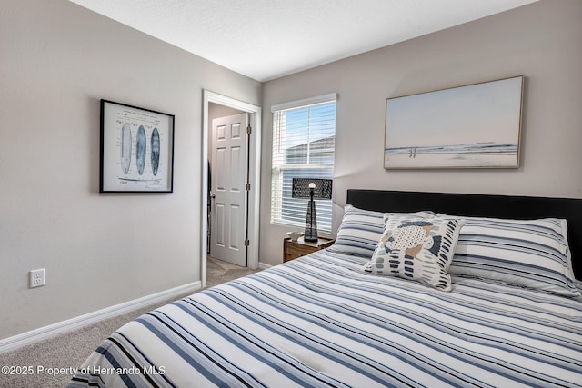 bedroom featuring baseboards and carpet floors
