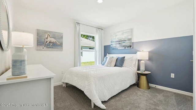 bedroom featuring baseboards and carpet flooring