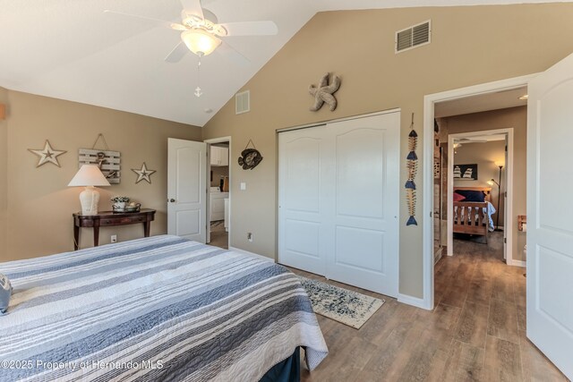 4285 Flexer Dr, Hernando Beach, FL 34607 - bedroom with wood finished floors, visible vents, high vaulted ceiling, and a closet