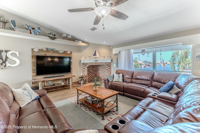 4285 Flexer Dr, Hernando Beach, FL 34607 - living room featuring wood finished floors, visible vents, and ceiling fan