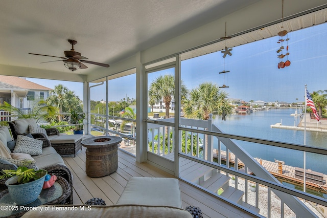 4285 Flexer Dr, Hernando Beach, FL 34607 - sunroom featuring a healthy amount of sunlight, a ceiling fan, and a water view