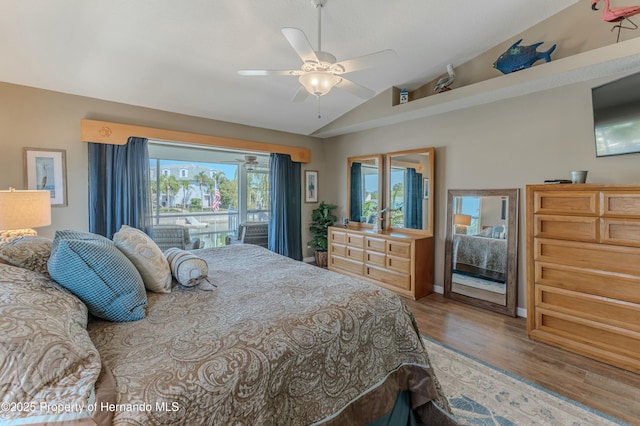4285 Flexer Dr, Hernando Beach, FL 34607 - bedroom featuring a ceiling fan, vaulted ceiling, and wood finished floors