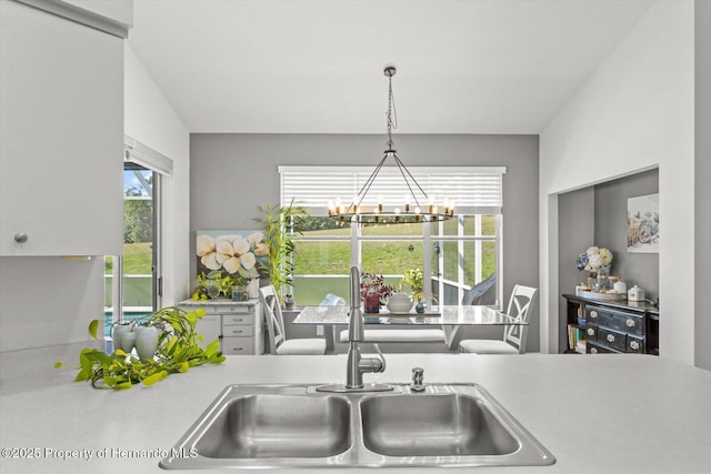 262 W Romany Loop, Beverly Hills, FL 34465 - kitchen with an inviting chandelier, light countertops, a sink, and hanging light fixtures