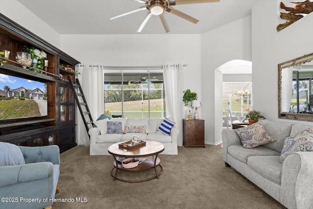 262 W Romany Loop, Beverly Hills, FL 34465 - living room with arched walkways, a ceiling fan, and carpet floors