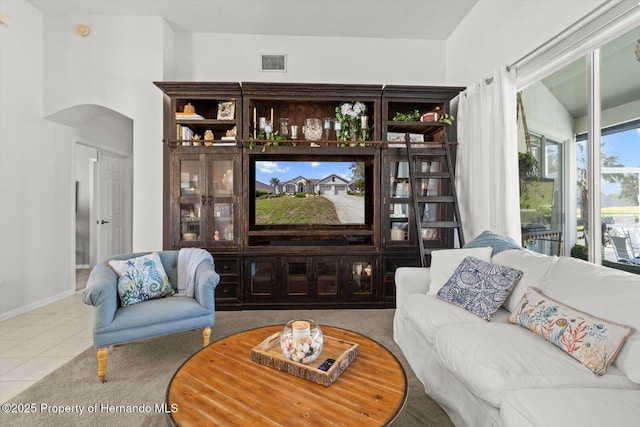 262 W Romany Loop, Beverly Hills, FL 34465 - living area with arched walkways, tile patterned flooring, visible vents, and baseboards