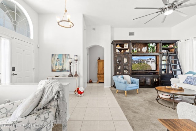 262 W Romany Loop, Beverly Hills, FL 34465 - tiled living room featuring a high ceiling, arched walkways, a ceiling fan, and visible vents