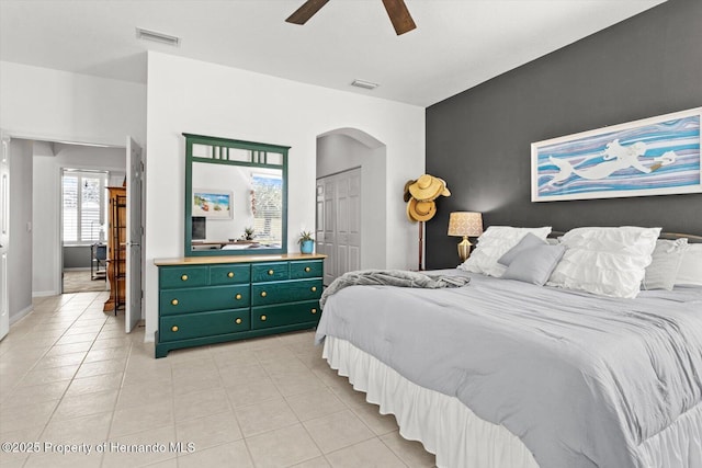 262 W Romany Loop, Beverly Hills, FL 34465 - bedroom featuring multiple windows, arched walkways, and light tile patterned flooring