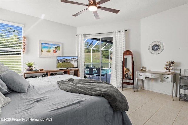 262 W Romany Loop, Beverly Hills, FL 34465 - bedroom with light tile patterned flooring, access to exterior, baseboards, and ceiling fan