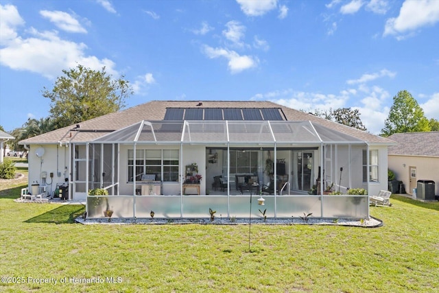 262 W Romany Loop, Beverly Hills, FL 34465 - back of house featuring central AC, a lanai, a yard, and a patio