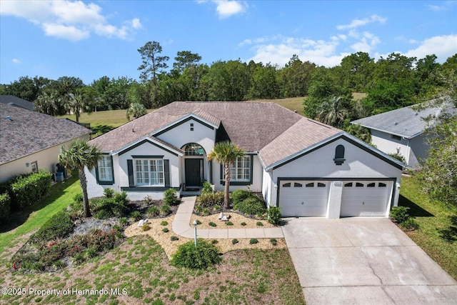 262 W Romany Loop, Beverly Hills, FL 34465 - ranch-style house with concrete driveway, an attached garage, and stucco siding