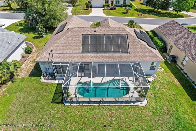 262 W Romany Loop, Beverly Hills, FL 34465 - back of house featuring an outdoor pool, a yard, solar panels, stucco siding, and a patio