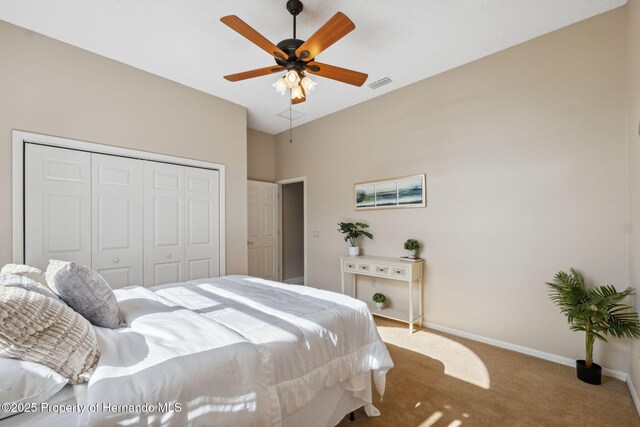 4469 Lake In The Woods Dr, Weeki Wachee, FL 34607 - carpeted bedroom featuring baseboards, visible vents, ceiling fan, and a closet