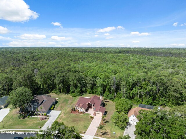 4469 Lake In The Woods Dr, Weeki Wachee, FL 34607 - drone / aerial view featuring a view of trees