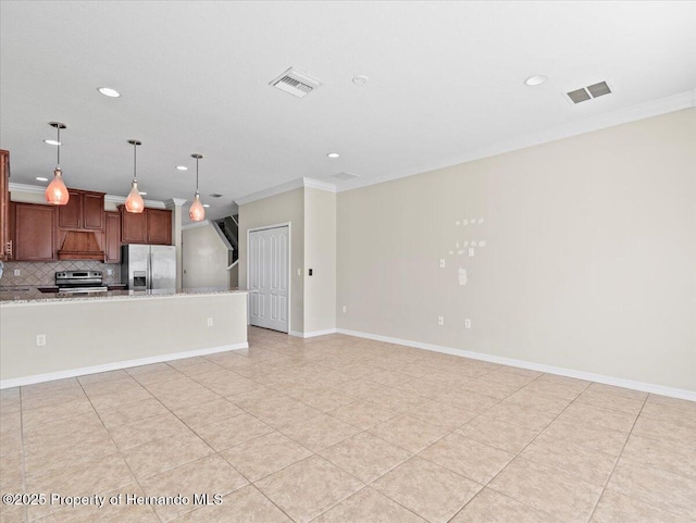 unfurnished living room with ornamental molding, recessed lighting, light tile patterned floors, and baseboards