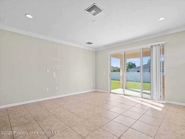 spare room with ornamental molding, tile patterned floors, recessed lighting, baseboards, and a textured ceiling