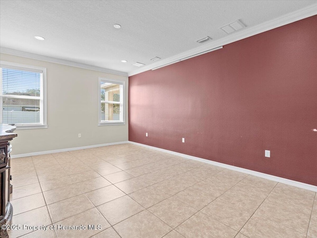 empty room with ornamental molding, light tile patterned floors, baseboards, recessed lighting, and a textured ceiling