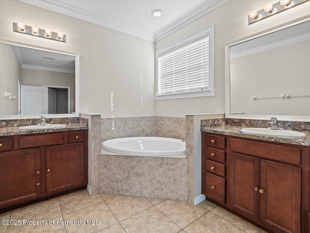 bathroom with tile patterned flooring, two vanities, a garden tub, and ornamental molding