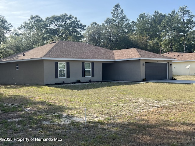 15297 Myland Rd, Weeki Wachee, FL 34614 - ranch-style home featuring stucco siding, a front yard, and a garage