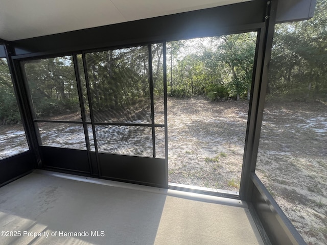 15297 Myland Rd, Weeki Wachee, FL 34614 - unfurnished sunroom featuring a healthy amount of sunlight