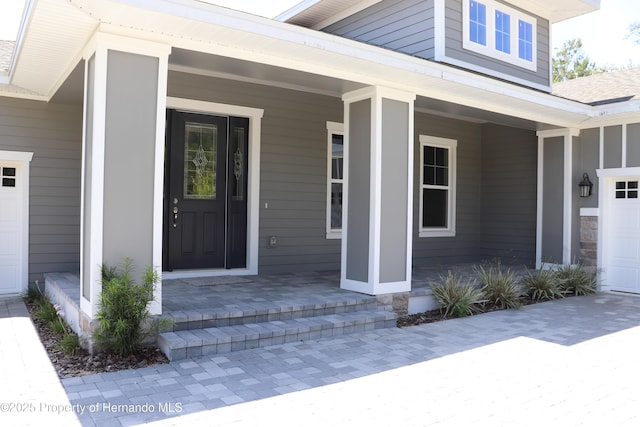 6063 Dusk Rose Ln, Brooksville, FL 34601 - entrance to property featuring a porch and a shingled roof