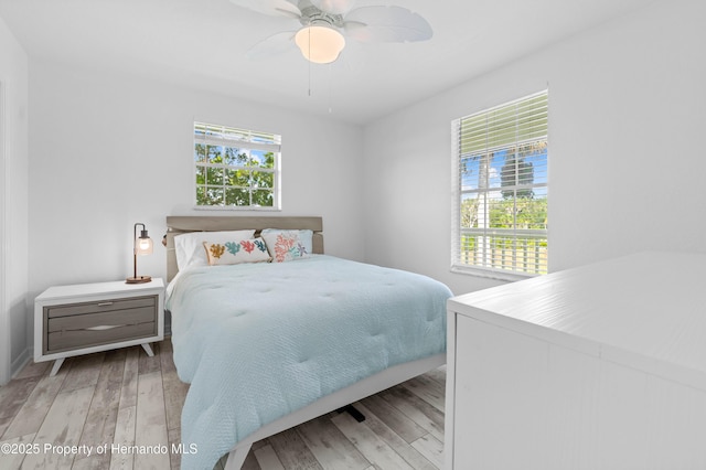 bedroom featuring ceiling fan and wood finished floors