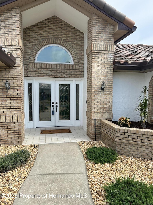 10519 Audie Brook Dr, Spring Hill, FL 34608 - property entrance featuring french doors and brick siding