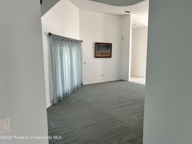 10519 Audie Brook Dr, Spring Hill, FL 34608 - unfurnished room featuring carpet floors, baseboards, and a towering ceiling