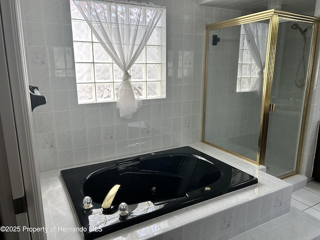 10519 Audie Brook Dr, Spring Hill, FL 34608 - full bath featuring a shower stall, a whirlpool tub, and tile patterned flooring