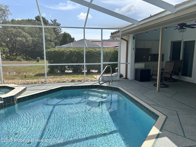 10519 Audie Brook Dr, Spring Hill, FL 34608 - view of swimming pool with a lanai, a patio area, and a ceiling fan
