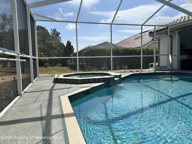 10519 Audie Brook Dr, Spring Hill, FL 34608 - view of pool featuring a pool with connected hot tub, a lanai, and a patio area