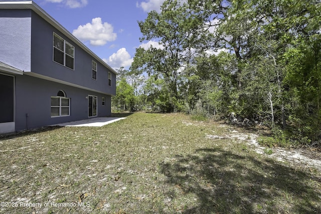 11257 Persimmon Ave, Weeki Wachee, FL 34614 - view of yard featuring a patio
