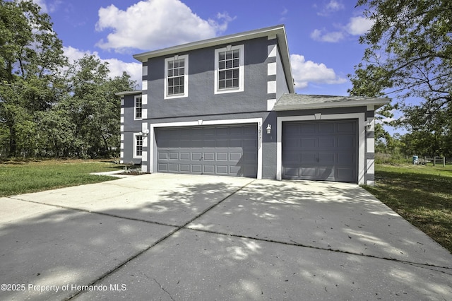 11257 Persimmon Ave, Weeki Wachee, FL 34614 - view of front of property with concrete driveway, an attached garage, stucco siding, a front lawn, and a garage