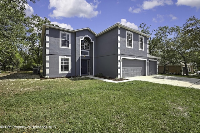 11257 Persimmon Ave, Weeki Wachee, FL 34614 - traditional home with concrete driveway, a front yard, an attached garage, and stucco siding