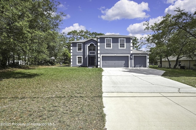 11257 Persimmon Ave, Weeki Wachee, FL 34614 - view of front facade with a front yard, driveway, an attached garage, and stucco siding