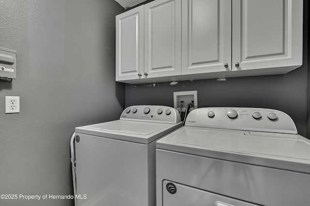 11257 Persimmon Ave, Weeki Wachee, FL 34614 - washroom featuring cabinet space and washing machine and dryer