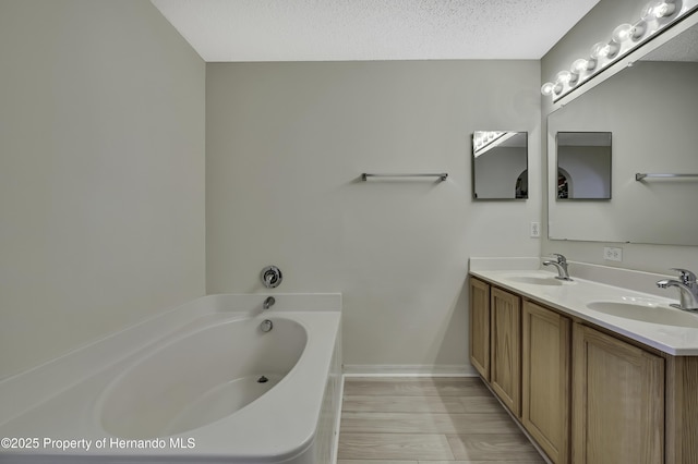 11257 Persimmon Ave, Weeki Wachee, FL 34614 - bathroom with baseboards, wood finished floors, a bath, and a sink